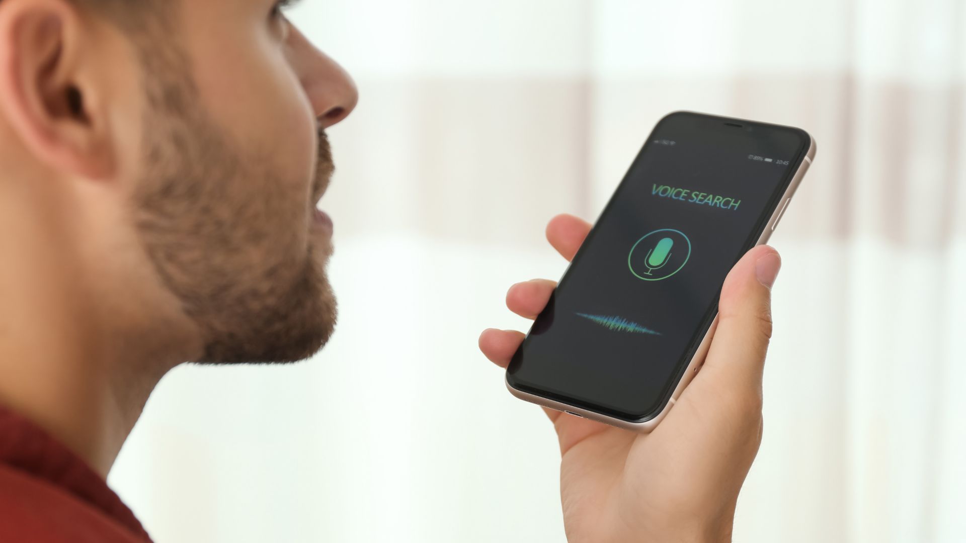 a man using a voice assistant to search