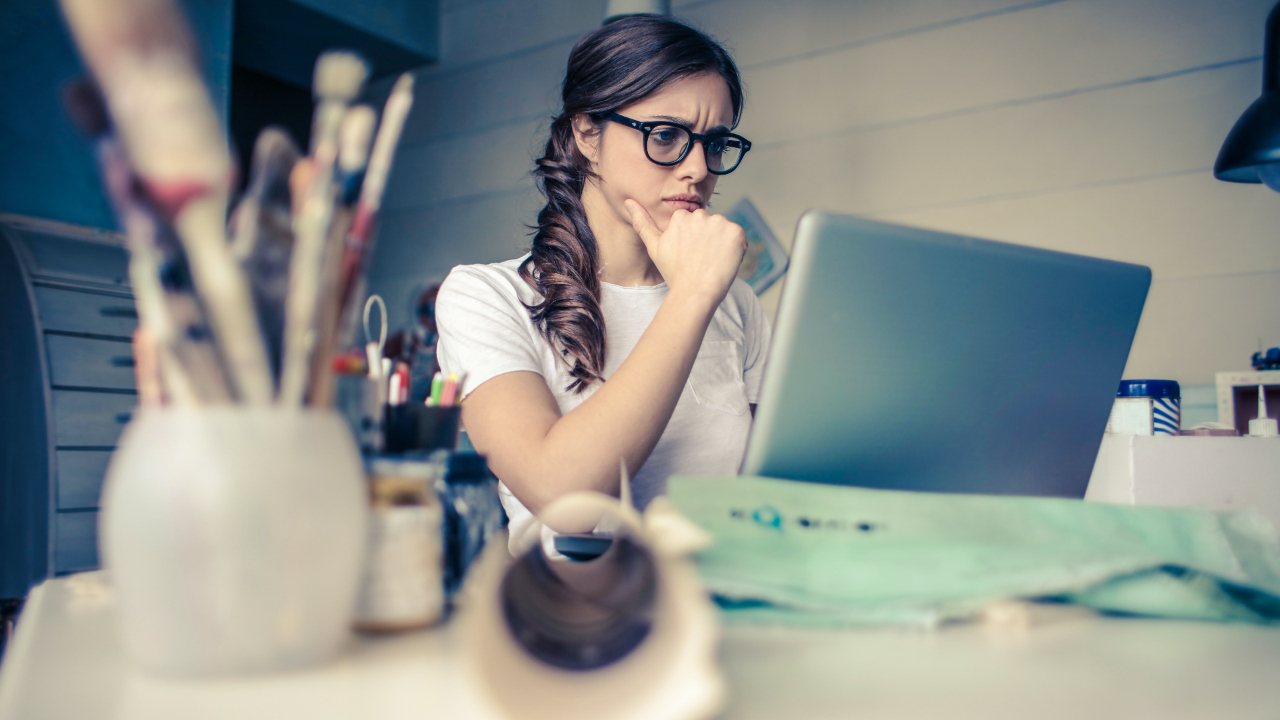woman on laptop with a focused look