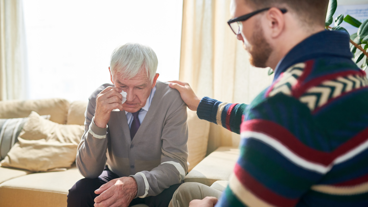 Two individuals engaged in a supportive conversation, offering a listening ear and understanding during a time of grief.
