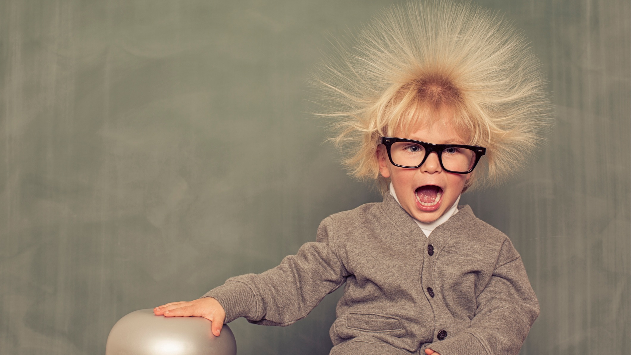 Young school box, intelligent, exploring static electricity, hair on end