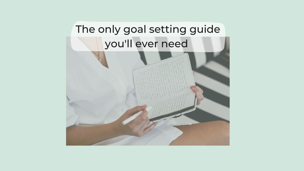 green background with woman journalling on black and white striped lounge holding a white pen wearing jewellery