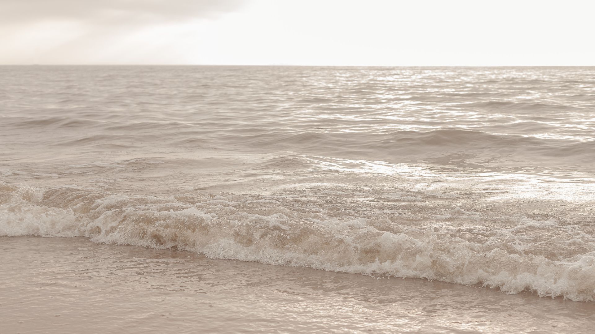 Calm morning view of the ocean, symbolizing the gentle and grounding energy needed for easing transitions.