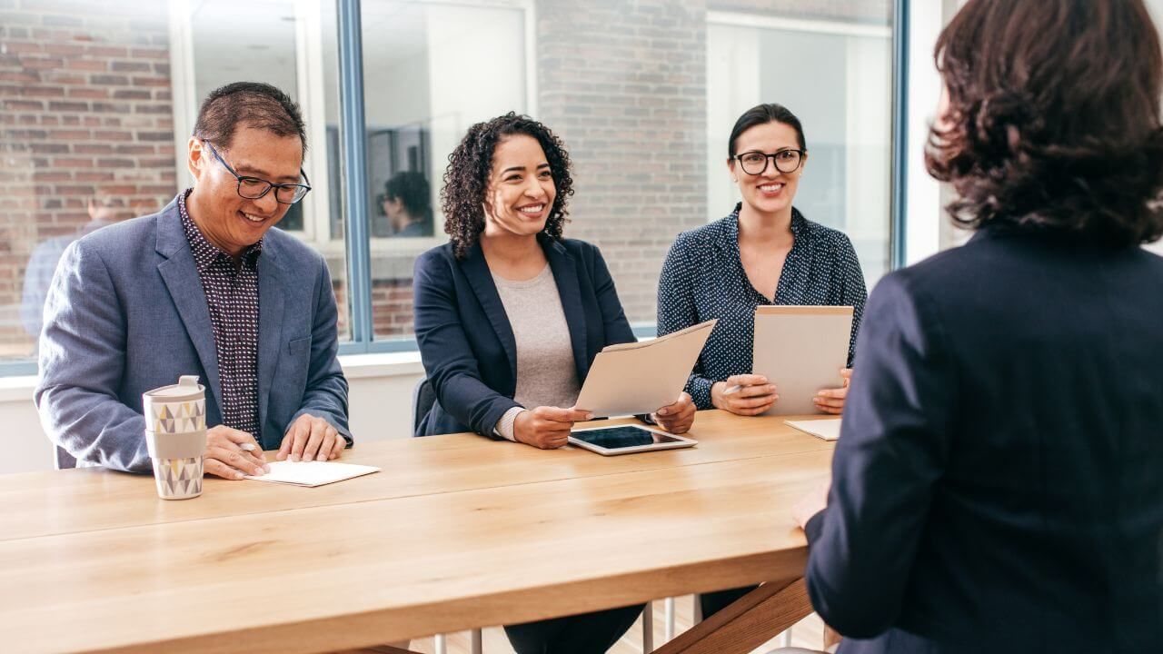 Interview board interviewing a job candidate