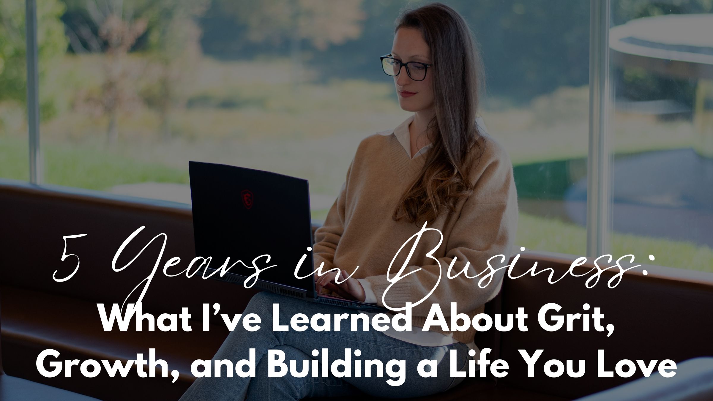 Ana smiling confidently at her desk, symbolizing growth and success after five years in business