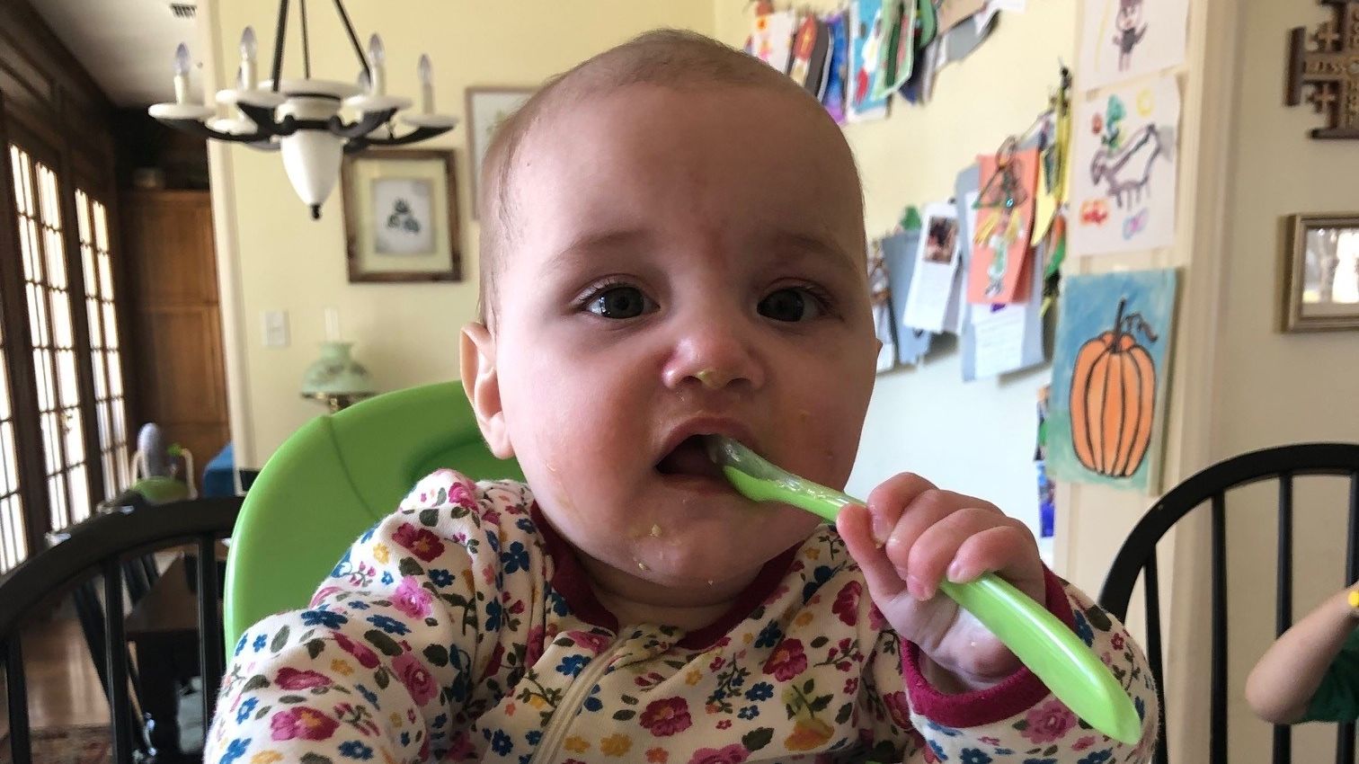 Baby eating with a spoon