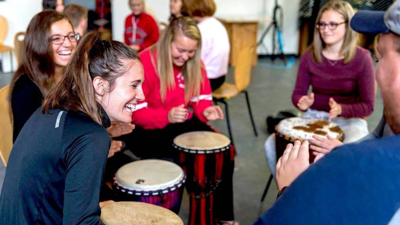 women playing in a drum circle