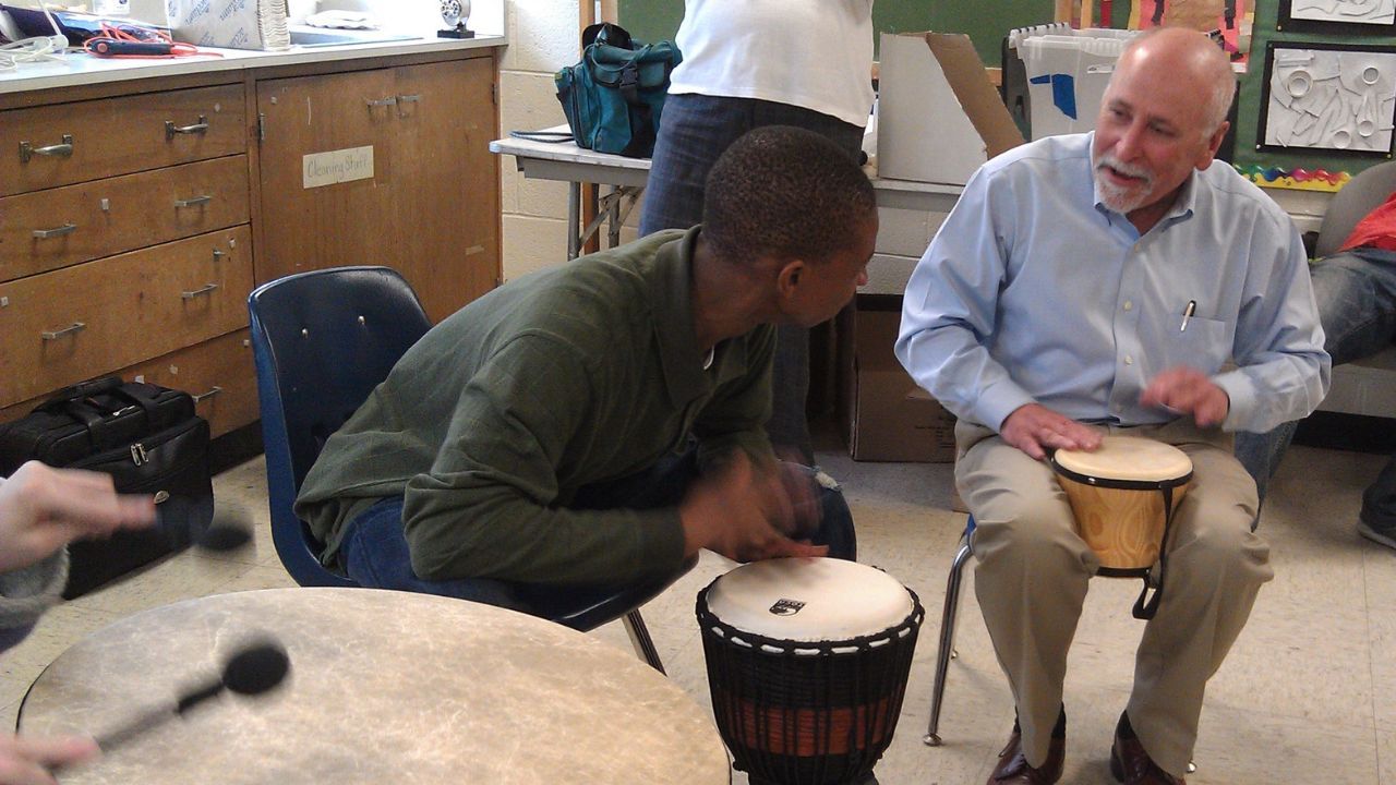 Drum therapy with Doctor and boy with Autism