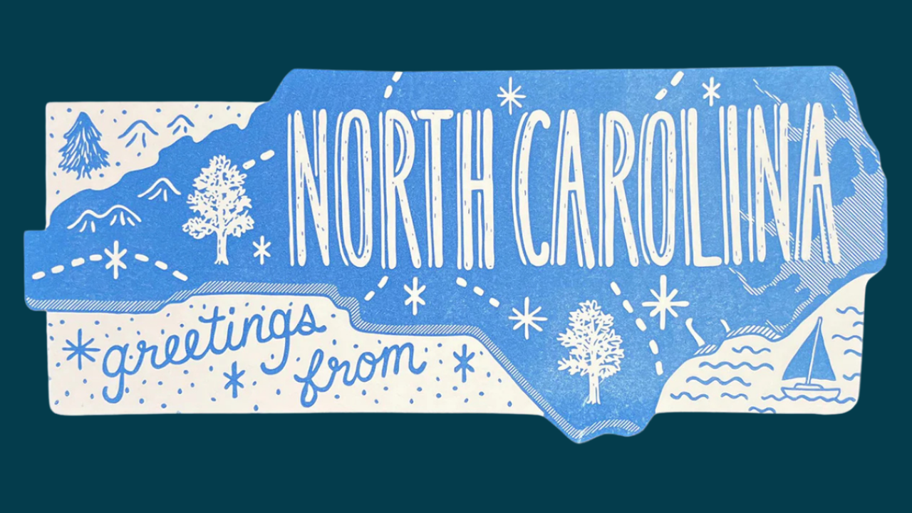 greetings from north carolina postcard image. Graphic of the state of North Carolina with snowy scenes.