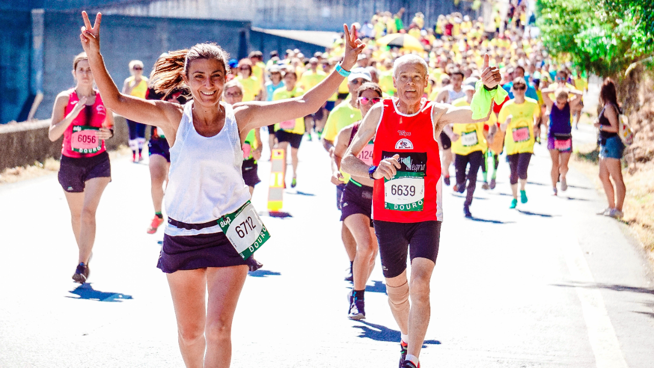 Group of diverse individuals running a marathon, symbolizing the vitality and youthfulness achieved through consistent exercise.