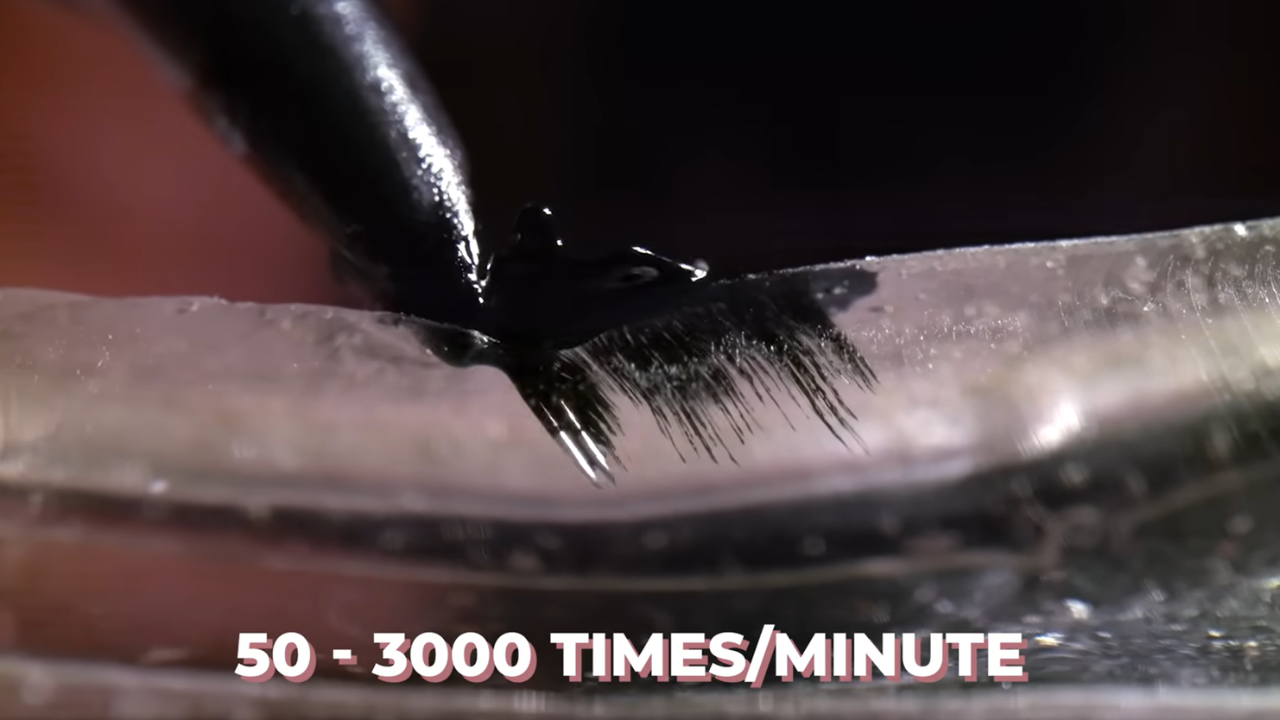 Close-up of a tattoo needle depositing black ink into human skin, demonstrating the rapid puncturing process (50–3000 times per minute) and how the ink penetrates the epidermis and dermis layers.