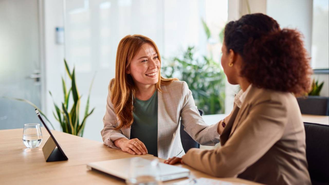 two business women at table