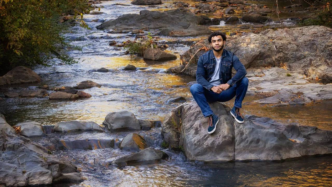 high school senior guy in creek