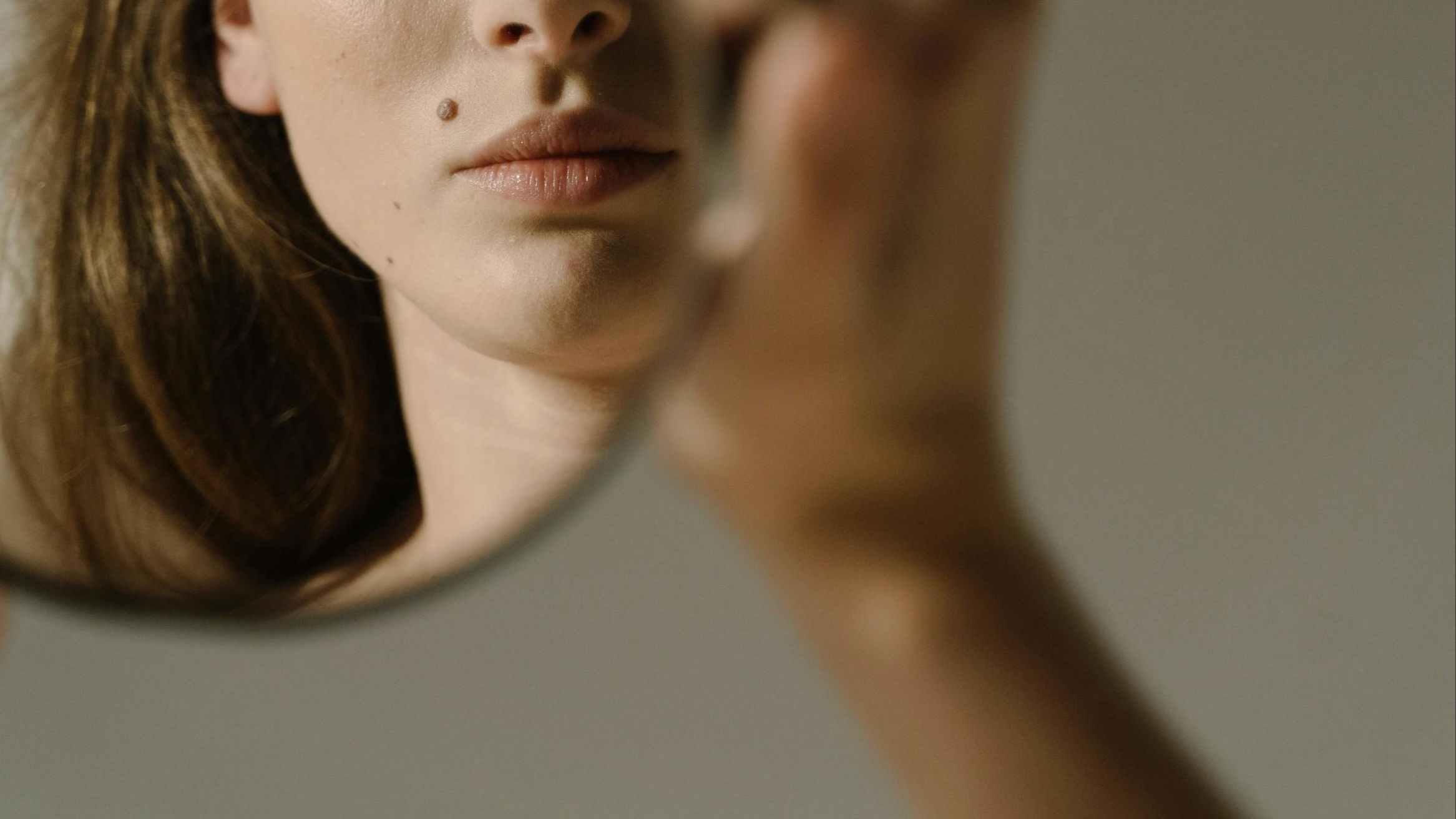 A woman looking into a mirror