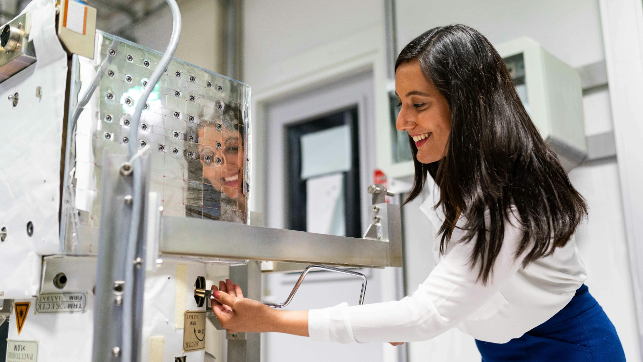 Scientist calibrating equipment