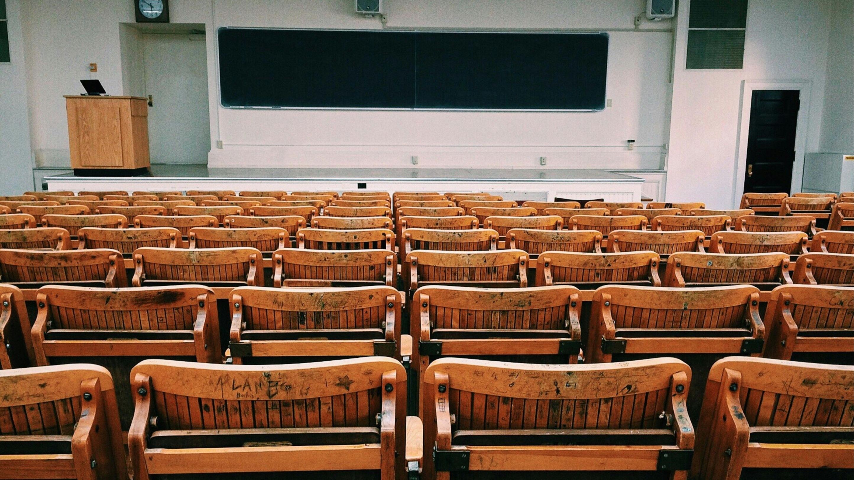 Classroom with row chairs and chalkboard