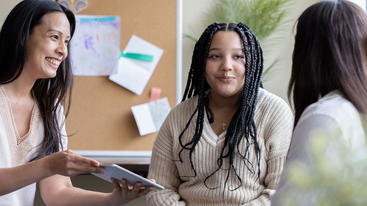 Middle school student with two caring adults