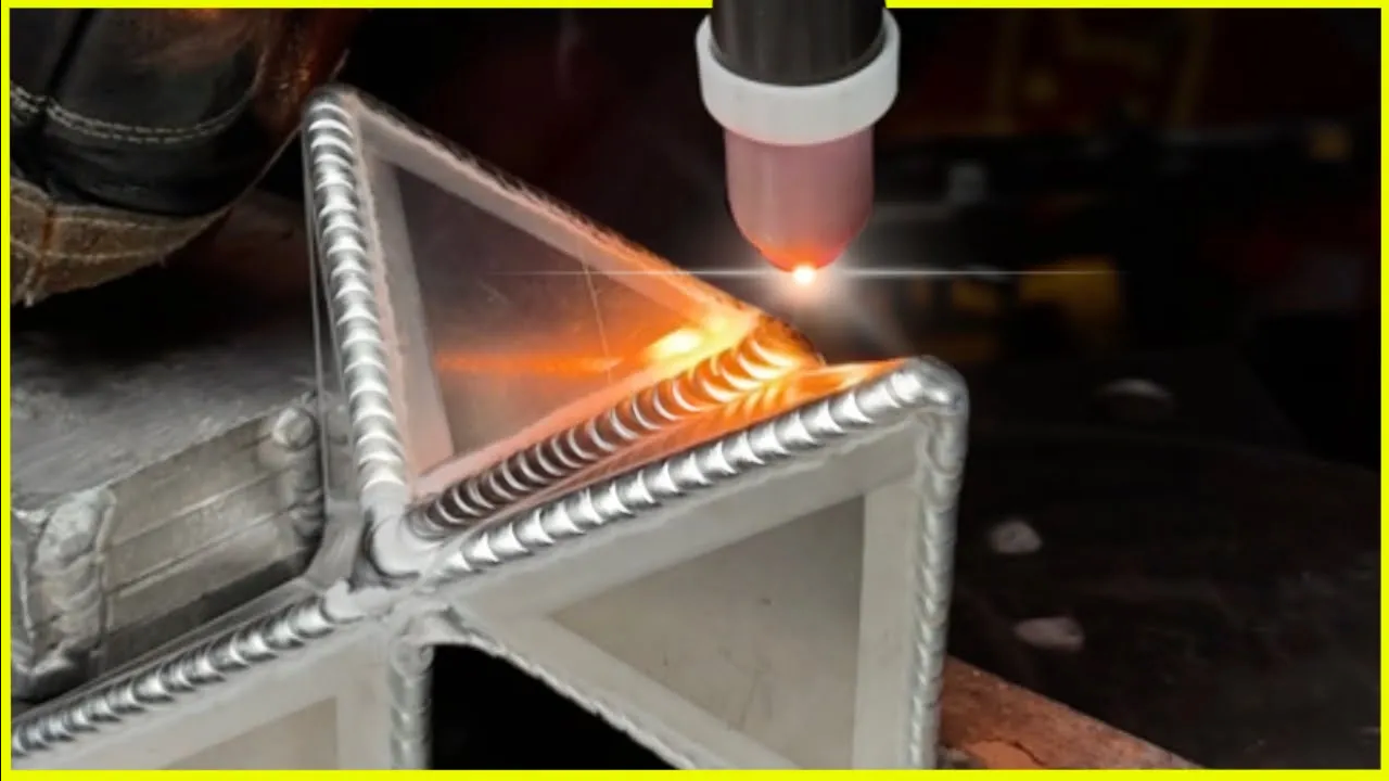 Aluminum pyramid sculpture made from TIG welded triangular panels.