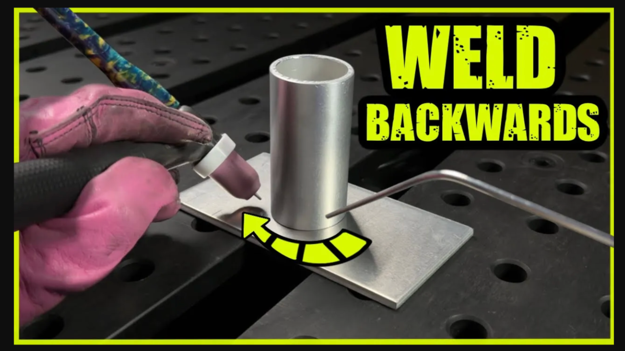 TIG welding aluminium tube welded backwards on a flat plate with torch and filler rod.