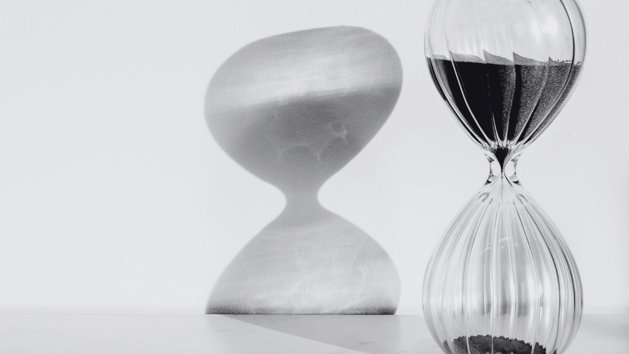 Symbolic image of an hourglass representing the emptiness many feel when external stability fails to bring real connection.