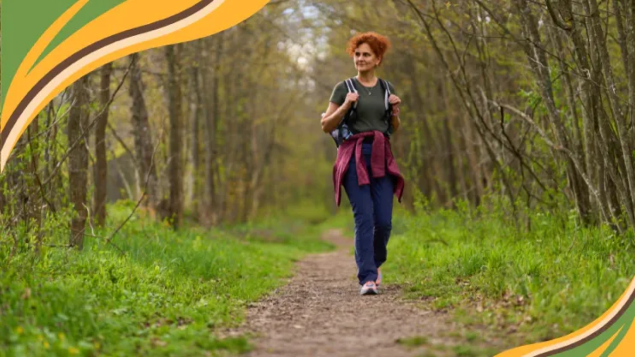 Woman over 60 walking confidently on a forest path, symbolizing psychological resilience over 60, gentle movement, and healthy aging through connection with nature.
