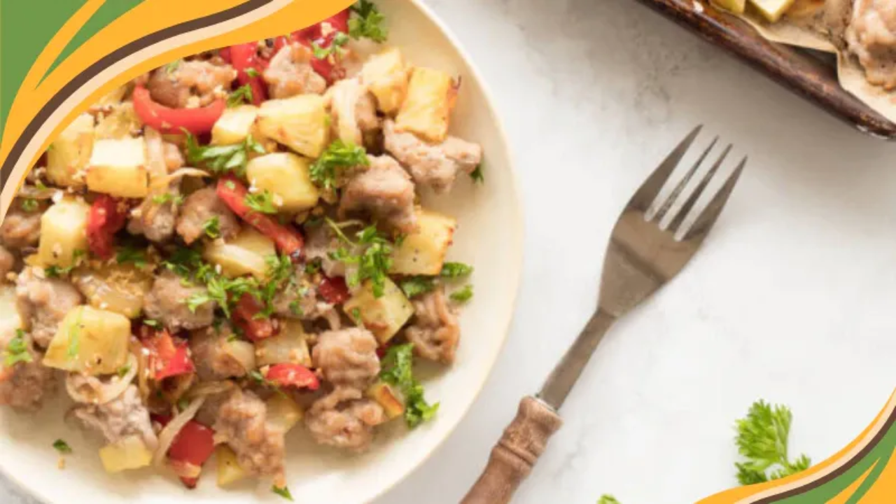 Healthy pork and vegetable hash served on a white plate.