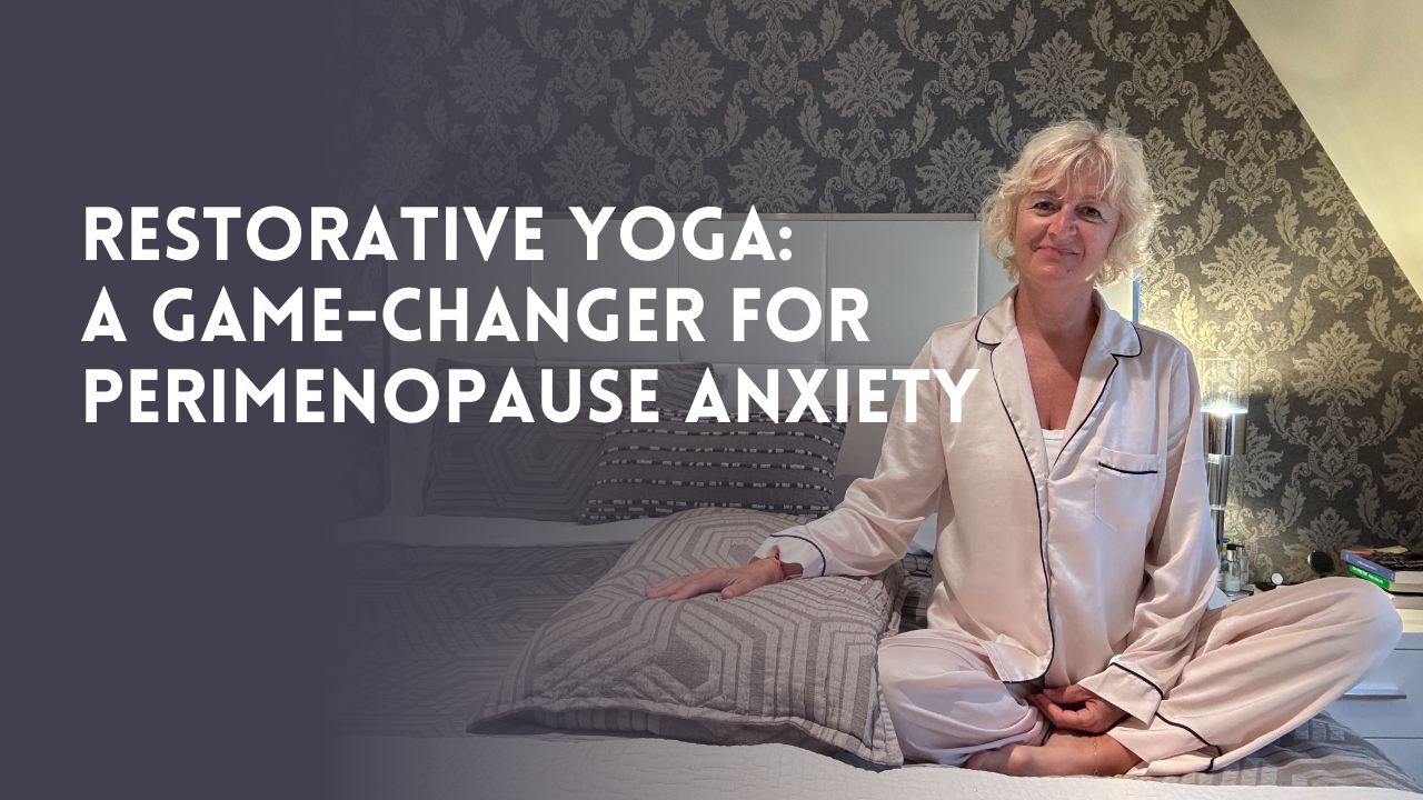 Julie Ann Garrido, Menopause Expert, in pyjamas on bed with pillow practicing restorative yoga for perimenopause anxiety