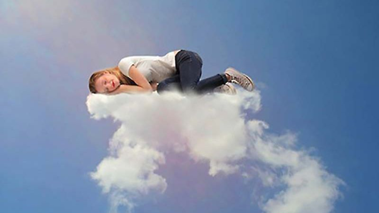 woman sleeping on a cloud and dreaming