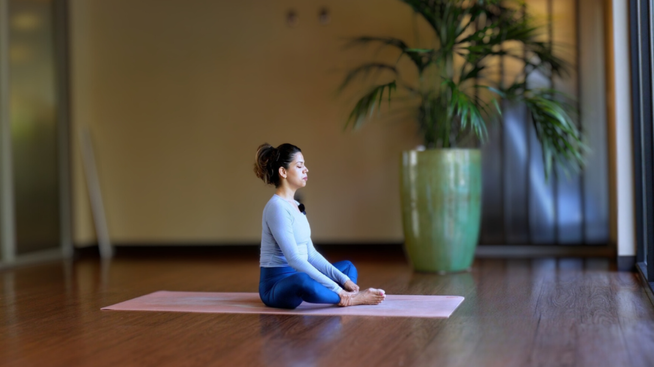 woman seated in butterfly pose