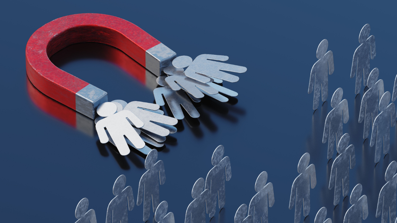 Magnet attracting metallic human figures