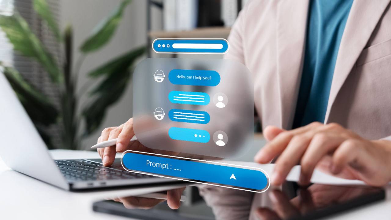 Person typing beside floating chatbot interface