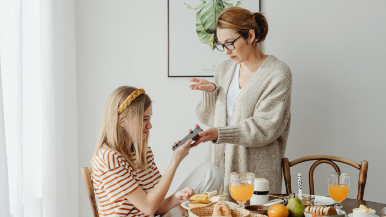 Mom having a supportive conversation with her teen daughter as part of life coaching for parents of teens focused on communication and connection