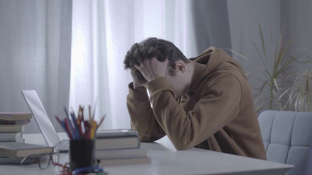 young adult feeling lost and unmotivated at home searching for direction and purpose