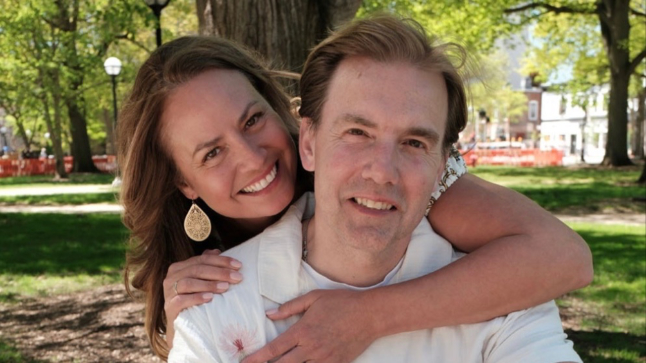 Three young adults sitting together on outdoor steps, relaxed and confident