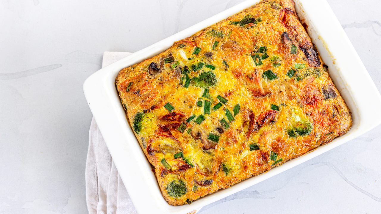 breakfast egg casserole in a white baking dish