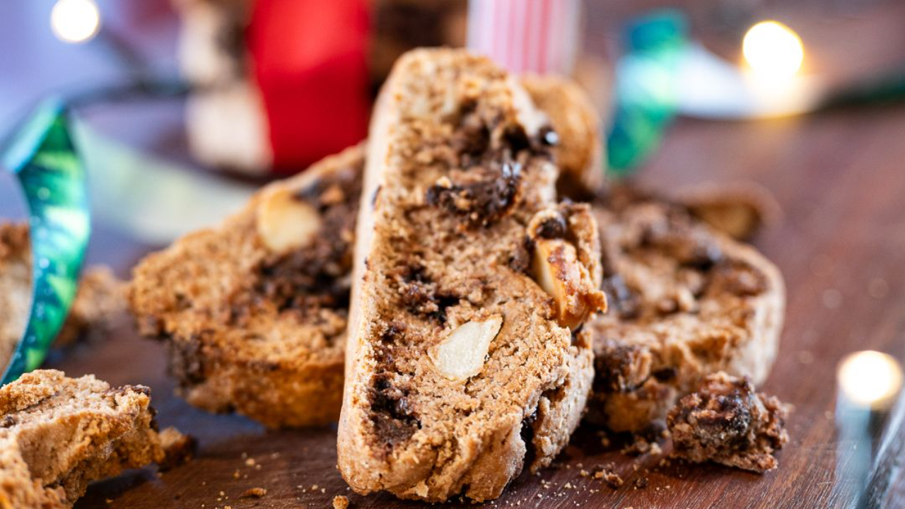 crispy chocolate hazelnut biscotti with sourdough discard tired up with christmas ribbon