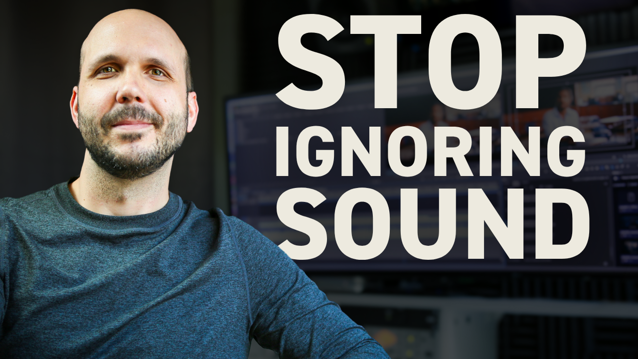 Professional video editor working on commercial sound design in editing software with multiple audio tracks