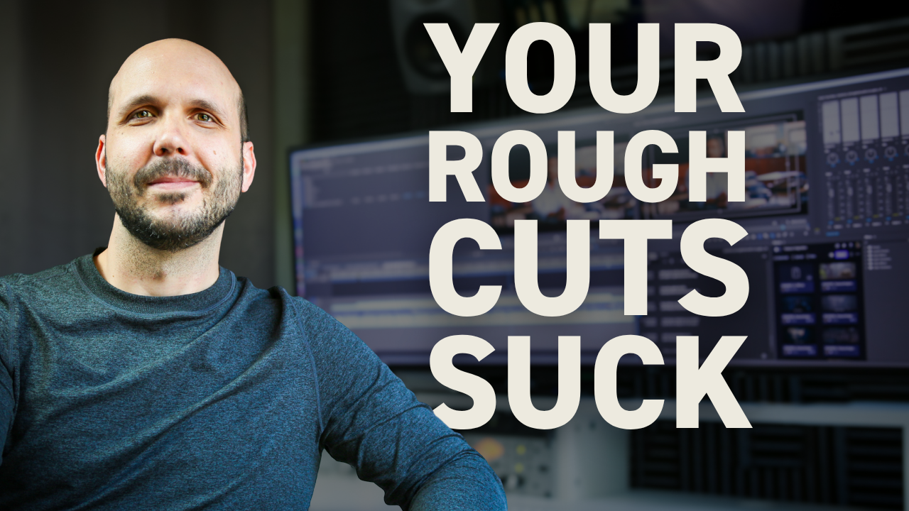 Professional video editor sitting in front of his edit suite with a focused expression.