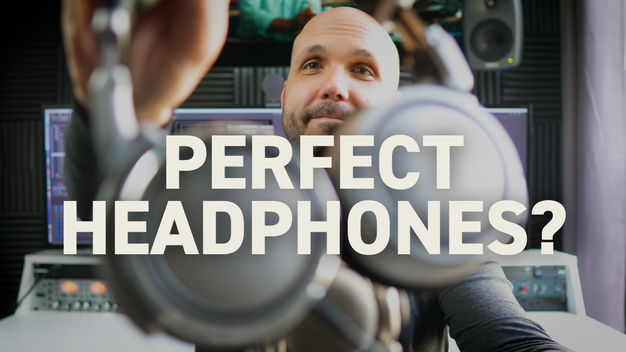 Neumann NDH 20 studio headphones held up by pro video editor at workstation.