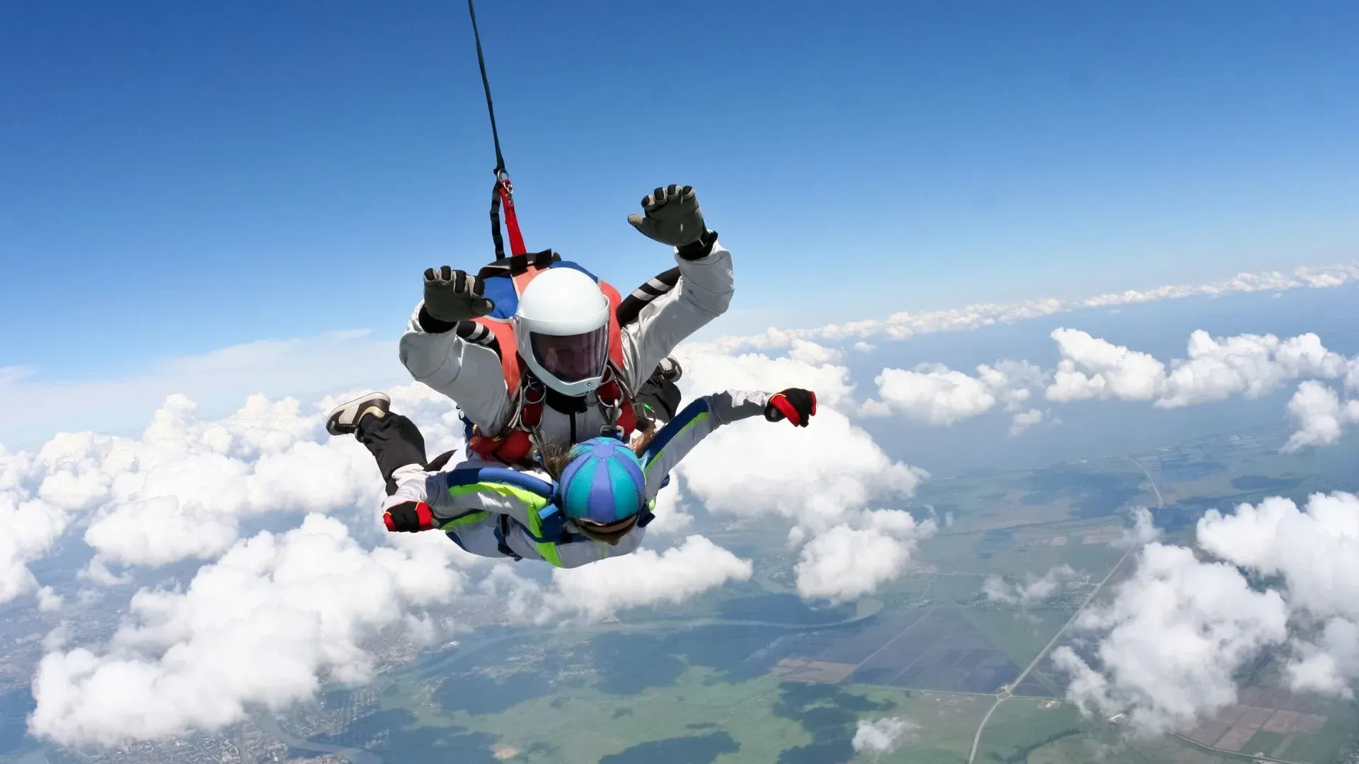 tandem skydivers with chute opening