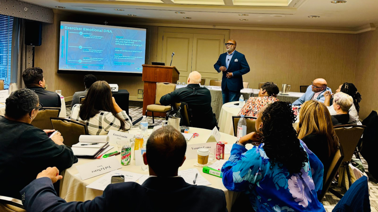 Director of Nursing leading a clinical team meeting, representing DON leadership development in healthcare