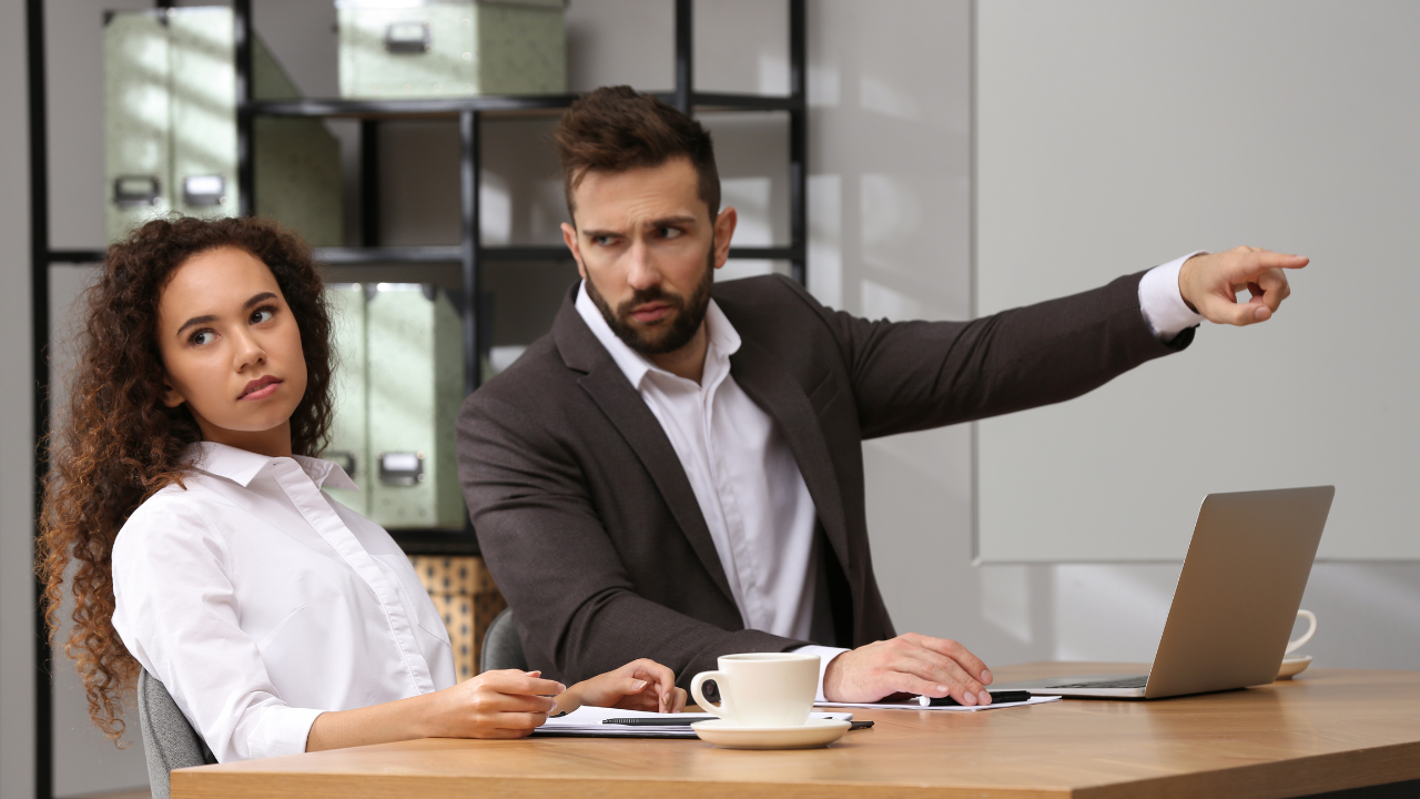 A diverse group of nonprofit leaders discussing a non-discrimination policy.