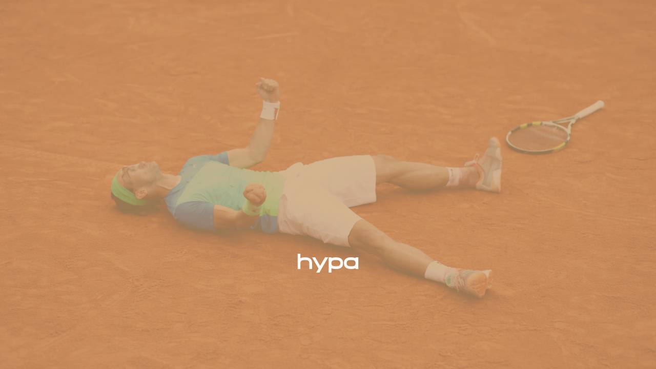 Tennis player lying on the clay court at Roland Garros after a match, racquet beside him, capturing a moment of clarity, release and emotional presence under pressure.