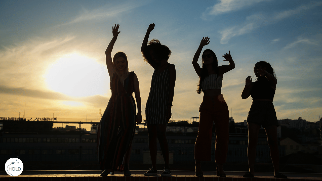 People dancing in the shadow of sunshine