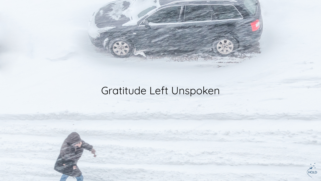 A woman struggles in the snow storm outside of her car