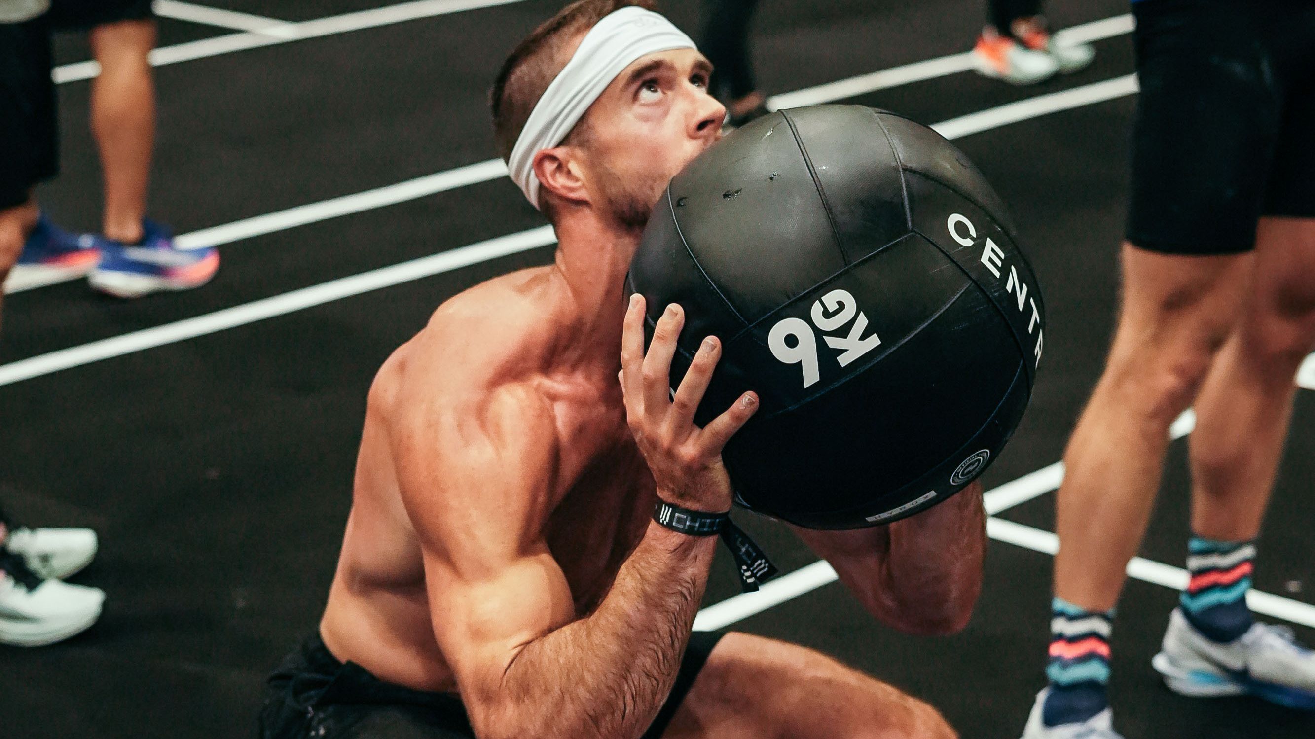 Hybrid athlete lifting weights 