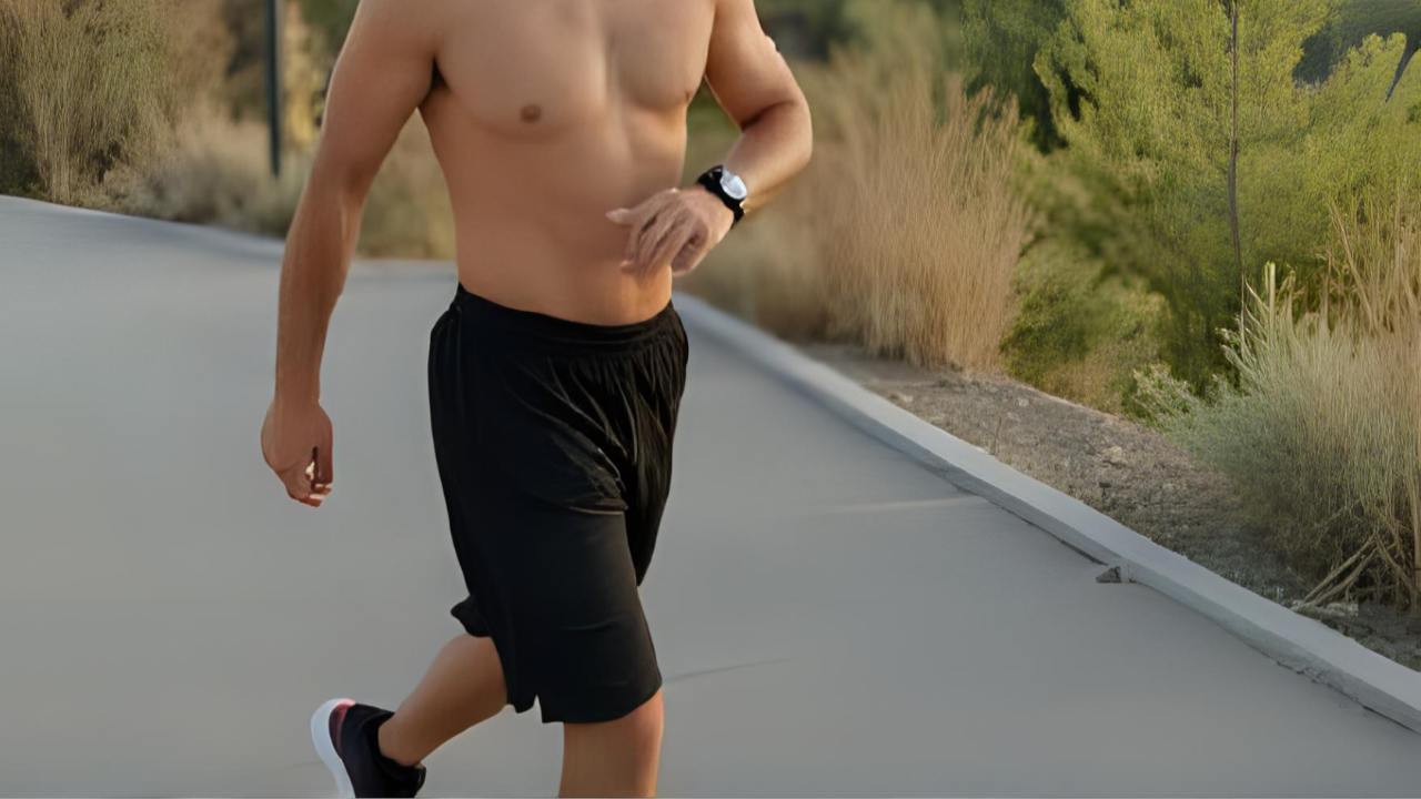 Person walking outdoors tracking steps on smartwatch during workout