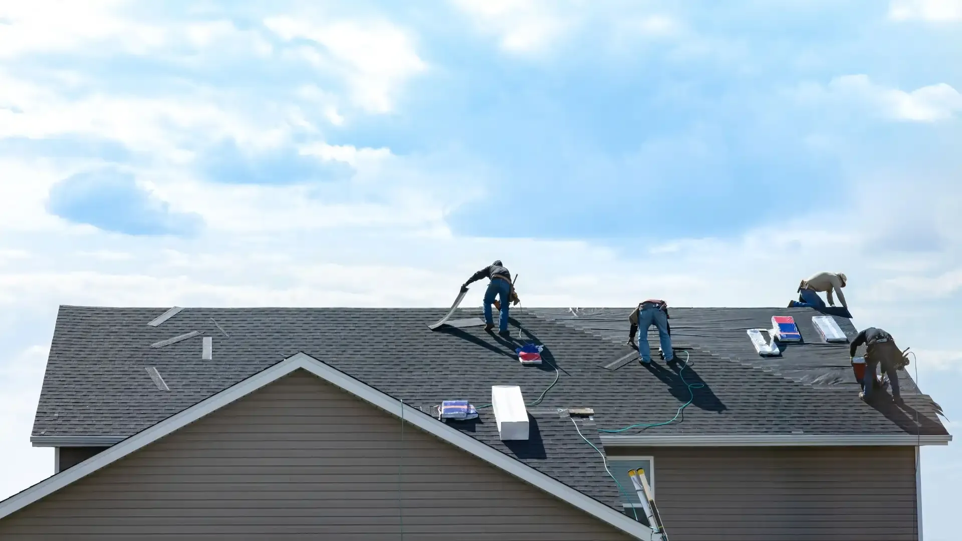 Limited licensed roofers working on a residential roof