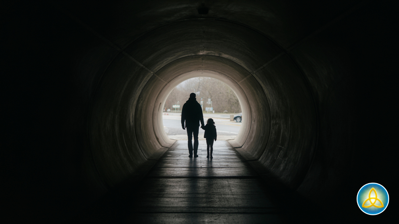 Father and child walking from darkness into light, representing the journey of psycho-spiritual integration