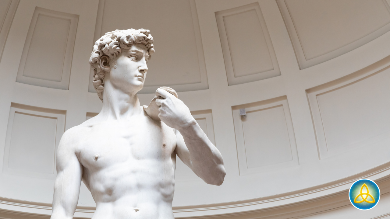 Michelangelo's David sculpture viewed from below, representing personal transformation through removal of what no longer serves
