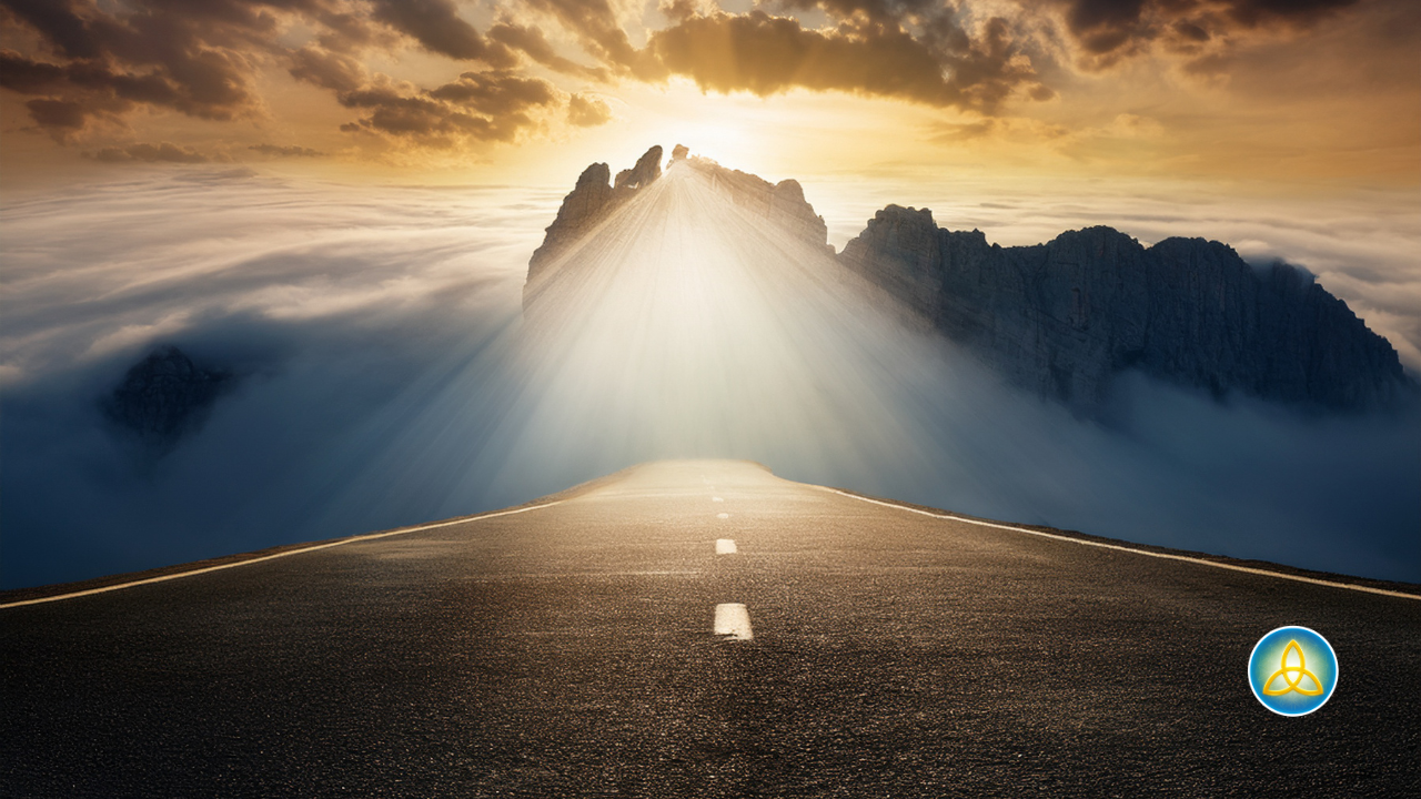 A road stretching toward mountains with sunlight breaking through clouds above, symbolizing the soul's journey toward meaning and purpose. Journey Mindfulness logo in the lower right corner.